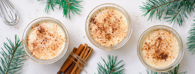Eggnog, Traditional Christmas Drink, Cocktail with Cinnamon and Nutmeg for Winter Holidays
