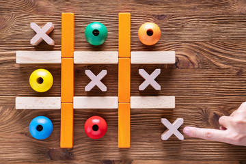 Wooden  tic tac toe (OX) game. The concept of strategy, risk, competition in business.