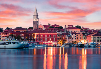 Splendid sunset of old fishing town Isola. Colorful spring evening on Adriatic Sea. Beautiful...