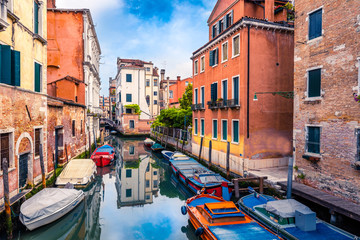 Colorful spring view of Vennice with famous water canal and colorful houses. Splendid morning scene in Italy, Europe. Magnificent Mediterranean cityscape. Traveling concept background.