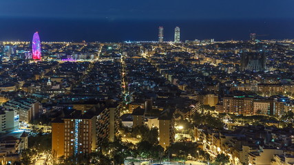 Obraz premium View of Barcelona timelapse, the Mediterranean sea, The tower Agbar and The twin towers from Bunkers Carmel. Catalonia, Spain.