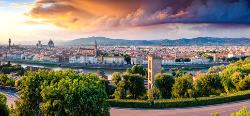 Fototapeta premium Unbelievable spring cityscape of Florence with Cathedral of Santa Maria del Fiore (Duomo) and Basilica of Santa Croce. Colorful sunset in Tuscany. Traveling concept background.