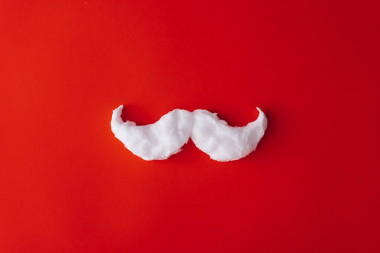 Christmas background. Santa's white hipster moustaches and copy space. Flat lay New year minimal.