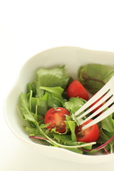 Homemade cherry tomato and baby leaves salad for healthy eating image