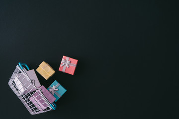 Creative layout of gift boxes. Shopping background. Minimal Black Friday sale concept. Flat lay.