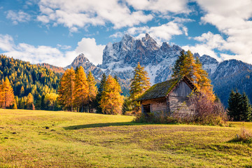 Splendid view of Durrenstein mountain from Vallone village. Colorful autumn scene in the Dolomite Alps, Province of Bolzano - South Tyrol, Itale, Europe. Artistic style post processed photo.