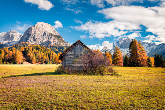 Sunny view of Rocca dei Baranci mountain from Vallone village. Colorful autumn scene in the Dolomite Alps, Province of Bolzano - South Tyrol, Itale, Europe. Artistic style post processed photo.