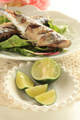 Japanese sudachi fruit and grilled pacific saury
