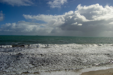Landscape of the ocean with clouds