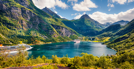 Picturesque summer scene of Geiranger port, western Norway. Colorful view of Sunnylvsfjorden fjord. Traveling concept background. Artistic style post processed photo. - obrazy, fototapety, plakaty