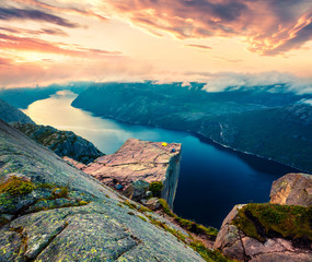 Impressive morning view of popular Norwegian attraction Preikestolen. Great summer sunrise of the Lysefjorden fjord, located in the Ryfylke area in southwestern Norway. - obrazy, fototapety, plakaty