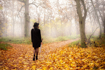 Girl in the park in the fog