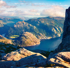 Colorful evening view of popular Norwegian attraction Preikestolen. Great summer scene of the Lysefjorden fjord, located in the Ryfylke area in southwestern Norway. 