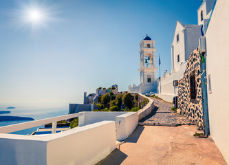Fototapeta premium Sunny morning view of Santorini island. Picturesque spring scene of the famous Greek resort Oia, Greece, Europe. Traveling concept background. Traveling concept background.