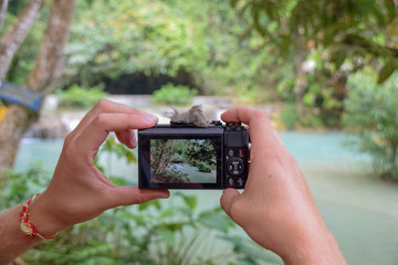 Taking a Picture at the Kuang Si Waterfalls, Laos.