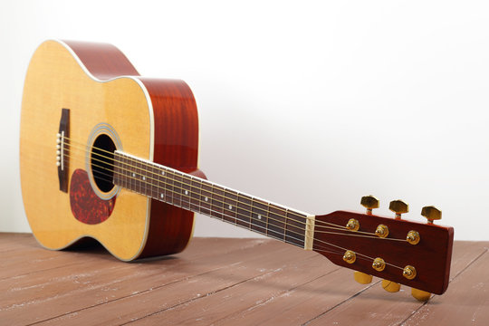 Musical instrument - Classic acoustic guitar wood and white background