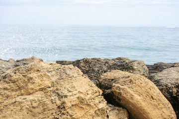 Fototapeta na wymiar Dettail of the waves jumping the rocks