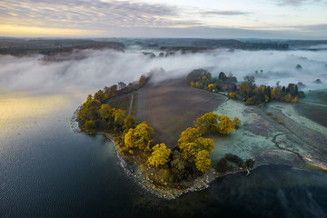 Morning mist on the banks of big lake