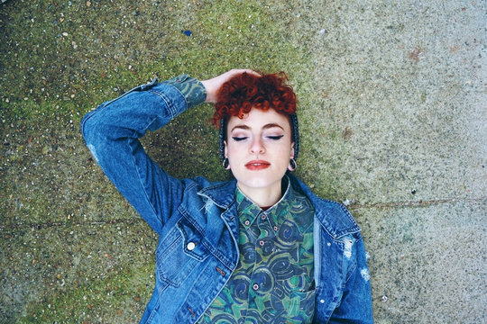 Beautiful and young redhead woman wearing vintage clothes
