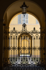 Fototapeta premium Entrance to italian palace with ancient iron fence
