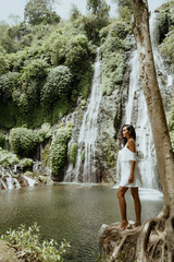 Female tourist enjoying waterfall