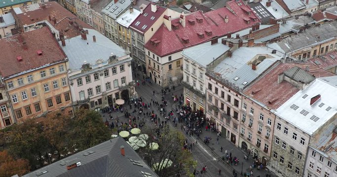 Crowd of people are walking on the Market Square, view from tower of City Hall, Lviv, Ukraine