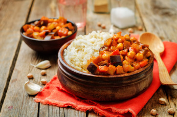 Fototapeta na wymiar Eggplant and tomato chickpea curry with rice