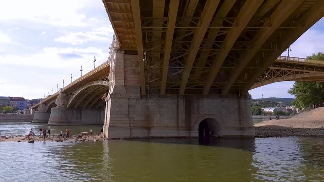 4K view of Margit Bridge from a boat in central Budapest, Hungary.