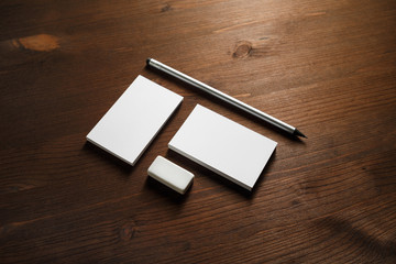 Blank corporate identity set on wood table background. Mockup for design presentations and portfolios.