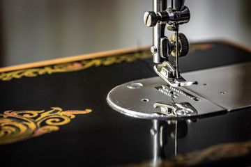 Sharp needle off sewing machine close up.