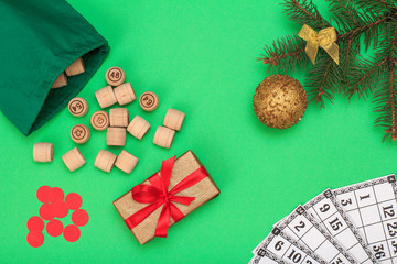 Wooden lotto barrels with bag and game cards for a game in lotto