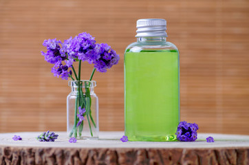 natural cosmetic bottle with fresh lavender flowers