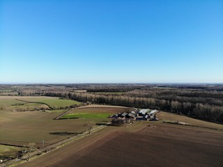 Fototapeta na wymiar Farmers field aerial photo taken on a clear blue sky day in Leeds West Yorkshire UK