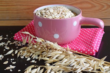 Useful dried fruits and walnuts on wooden background.