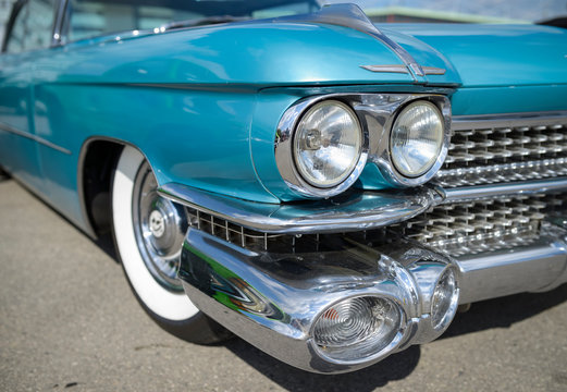 Detail of old timer, turquoise Cadillac