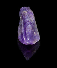 Natural untreated crystal amethyst on a black background