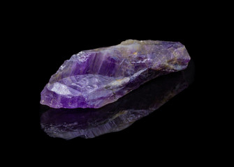 Natural untreated crystal amethyst on a black background