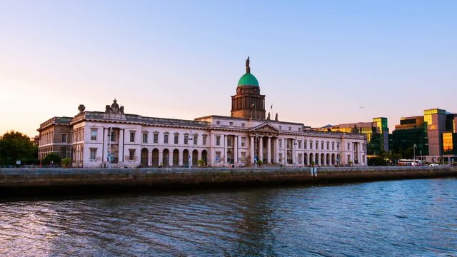 Dublin, Ireland. The Custom house in Dublin, Ireland in the evening. Time-lapse video at sunset. Clear colorful sky, zoom in