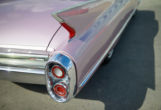 Detail of old timer, pink Cadillac