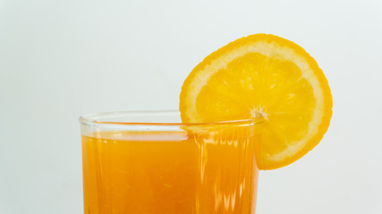 orange fruit with leaf on white background