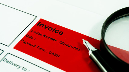 Invoice business document  close up with pen background