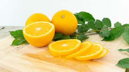 orange fruit with leaf on white background