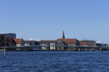 Panoramic view of the harbor of Copenhagen with houses and a pedestrian bridge, Denmark