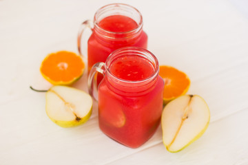 Homemade lemonade from watermelon and lemon in glass cups on a light background