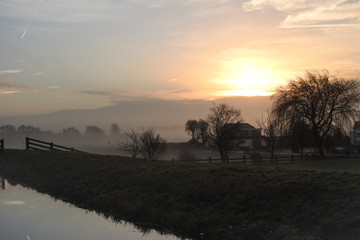 Low fog over the dutch countryside at sunrise