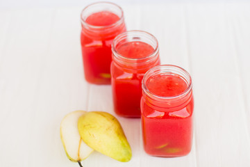 Fototapeta na wymiar Homemade lemonade from watermelon and lemon in glass cups on a light background