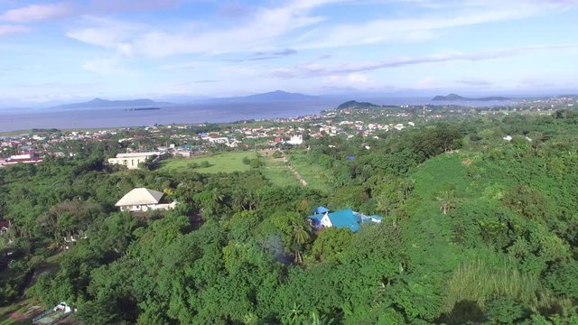 Los Ba&ntilde;os, Laguna, Philippines - November 21, 2017: Mountain rainforest modern housing built. Drone Aerial