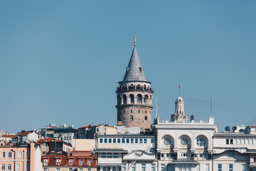 Fototapeta na wymiar modern building and galata tower - ancient technology and religion - november 2018 - istanbul turkey