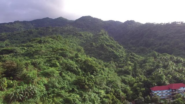 Los Ba&ntilde;os, Laguna, Philippines - November 21, 2017: Mountain rainforest modern housing built. Drone Aerial