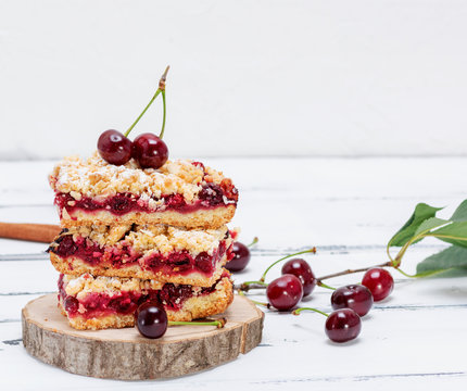 stack of baked cake with cherry berries